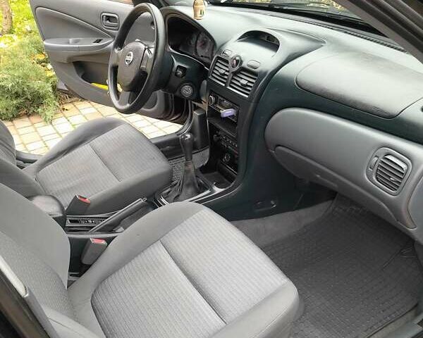 Черный Ниссан Альмера, объемом двигателя 1.6 л и пробегом 180 тыс. км за 4000 $, фото 12 на Automoto.ua