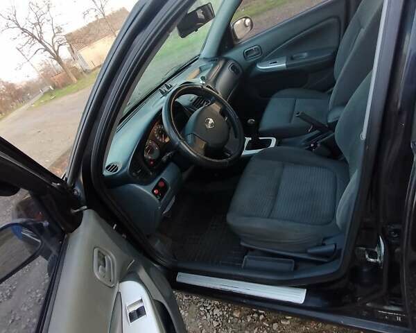 Черный Ниссан Альмера, объемом двигателя 1.6 л и пробегом 244 тыс. км за 4500 $, фото 51 на Automoto.ua