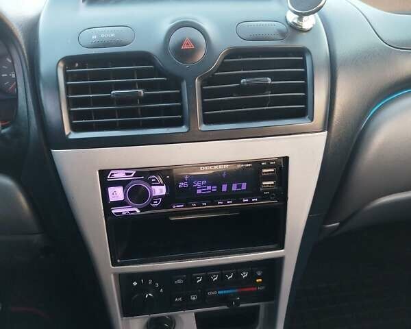 Черный Ниссан Альмера, объемом двигателя 1.6 л и пробегом 244 тыс. км за 4500 $, фото 45 на Automoto.ua