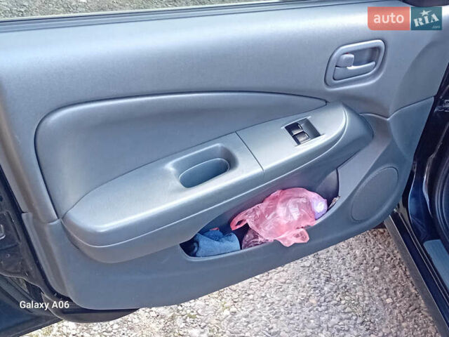 Черный Ниссан Альмера, объемом двигателя 1.6 л и пробегом 185 тыс. км за 4500 $, фото 48 на Automoto.ua