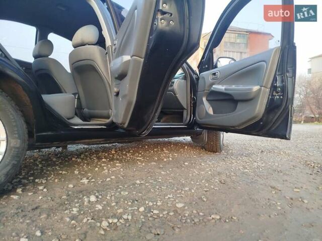 Черный Ниссан Альмера, объемом двигателя 1.6 л и пробегом 244 тыс. км за 4500 $, фото 52 на Automoto.ua