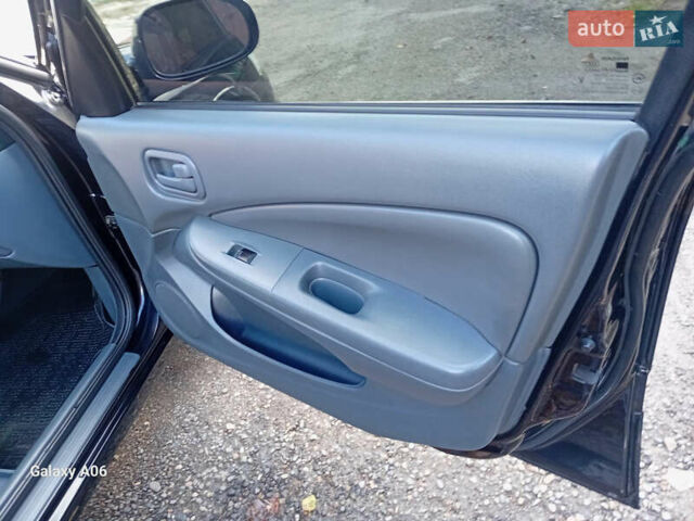 Черный Ниссан Альмера, объемом двигателя 1.6 л и пробегом 185 тыс. км за 4500 $, фото 53 на Automoto.ua