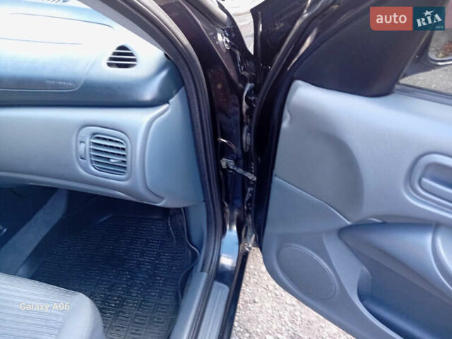 Черный Ниссан Альмера, объемом двигателя 1.6 л и пробегом 185 тыс. км за 4500 $, фото 54 на Automoto.ua