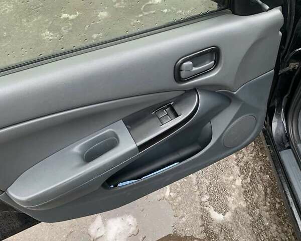 Чорний Ніссан Альмера, об'ємом двигуна 1.6 л та пробігом 300 тис. км за 2999 $, фото 6 на Automoto.ua