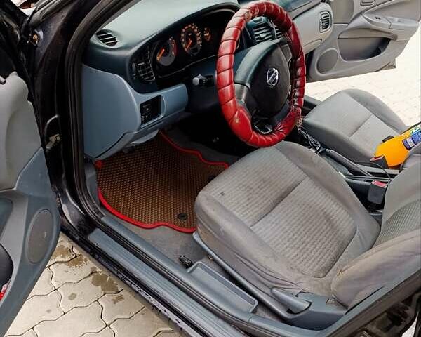 Черный Ниссан Альмера, объемом двигателя 1.6 л и пробегом 224 тыс. км за 3300 $, фото 2 на Automoto.ua