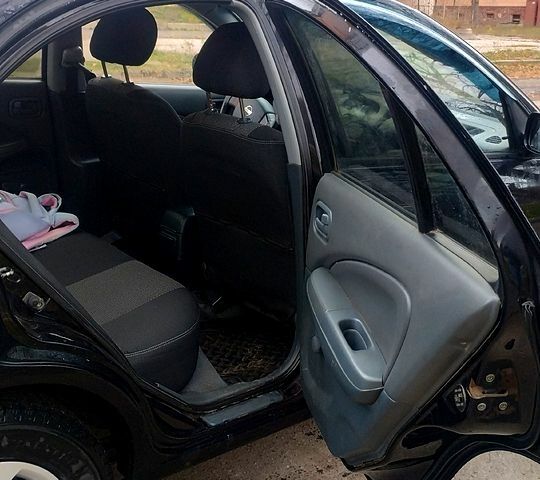 Черный Ниссан Альмера, объемом двигателя 1.6 л и пробегом 262 тыс. км за 5400 $, фото 7 на Automoto.ua