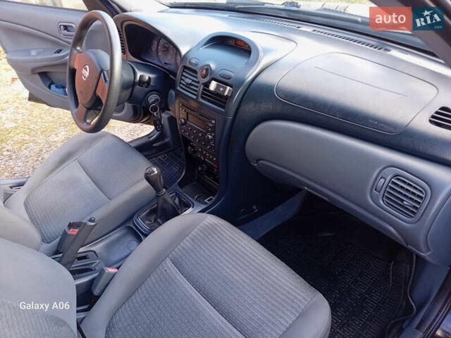 Черный Ниссан Альмера, объемом двигателя 1.6 л и пробегом 185 тыс. км за 4500 $, фото 70 на Automoto.ua