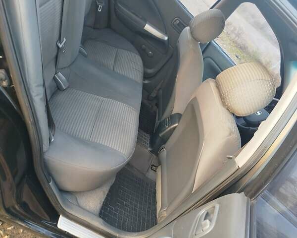 Черный Ниссан Альмера, объемом двигателя 1.6 л и пробегом 244 тыс. км за 4500 $, фото 46 на Automoto.ua