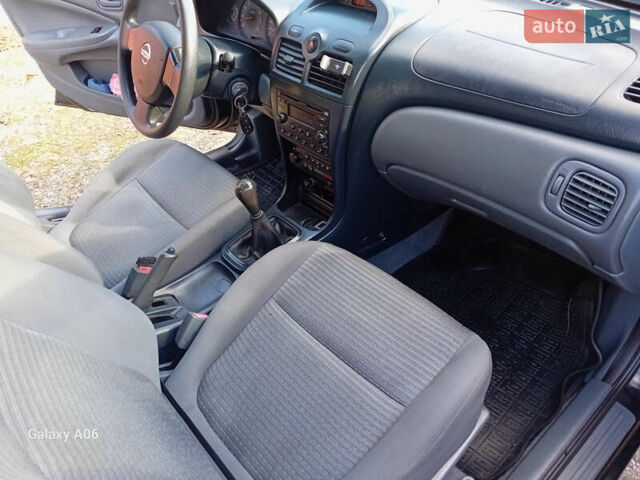 Черный Ниссан Альмера, объемом двигателя 1.6 л и пробегом 185 тыс. км за 4500 $, фото 55 на Automoto.ua