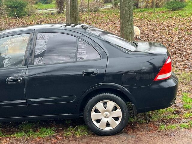 Черный Ниссан Альмера, объемом двигателя 1.6 л и пробегом 203 тыс. км за 5990 $, фото 6 на Automoto.ua