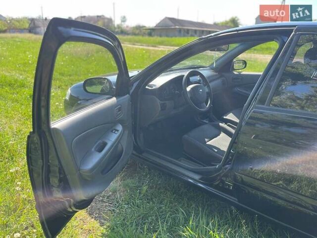 Чорний Ніссан Альмера, об'ємом двигуна 1.6 л та пробігом 202 тис. км за 5800 $, фото 8 на Automoto.ua
