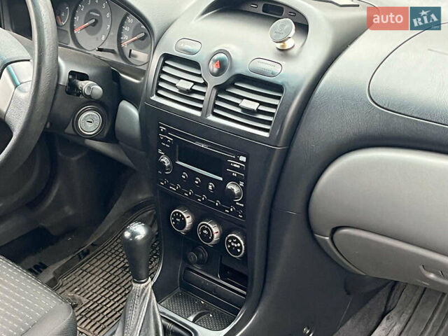 Чорний Ніссан Альмера, об'ємом двигуна 1.6 л та пробігом 203 тис. км за 5990 $, фото 19 на Automoto.ua