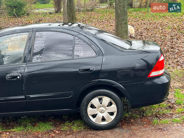 Чорний Ніссан Альмера, об'ємом двигуна 1.6 л та пробігом 203 тис. км за 5990 $, фото 6 на Automoto.ua