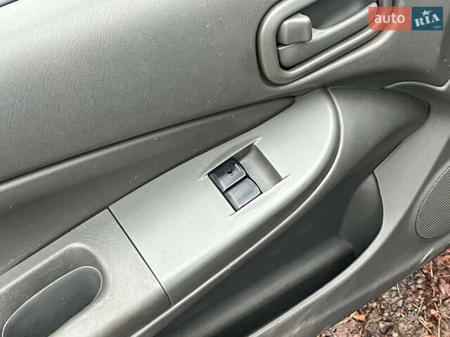 Чорний Ніссан Альмера, об'ємом двигуна 1.6 л та пробігом 203 тис. км за 5990 $, фото 28 на Automoto.ua