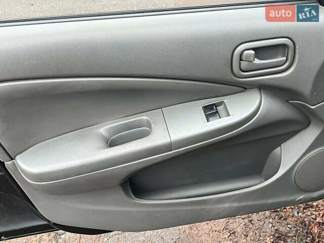 Чорний Ніссан Альмера, об'ємом двигуна 1.6 л та пробігом 203 тис. км за 5990 $, фото 27 на Automoto.ua