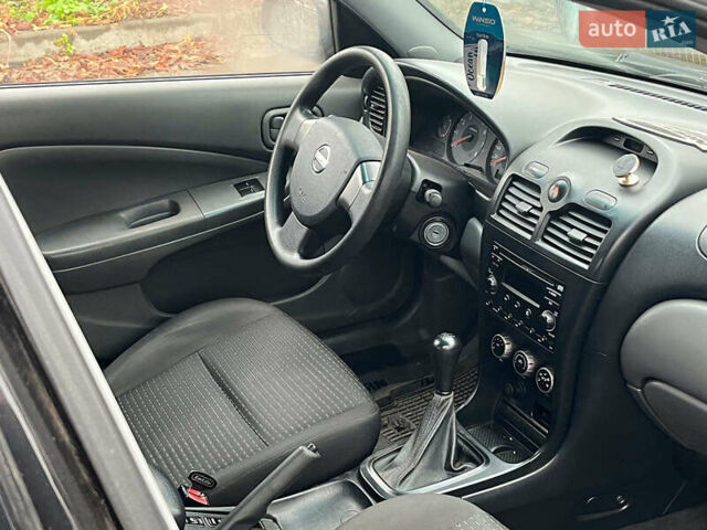 Чорний Ніссан Альмера, об'ємом двигуна 1.6 л та пробігом 203 тис. км за 5990 $, фото 18 на Automoto.ua