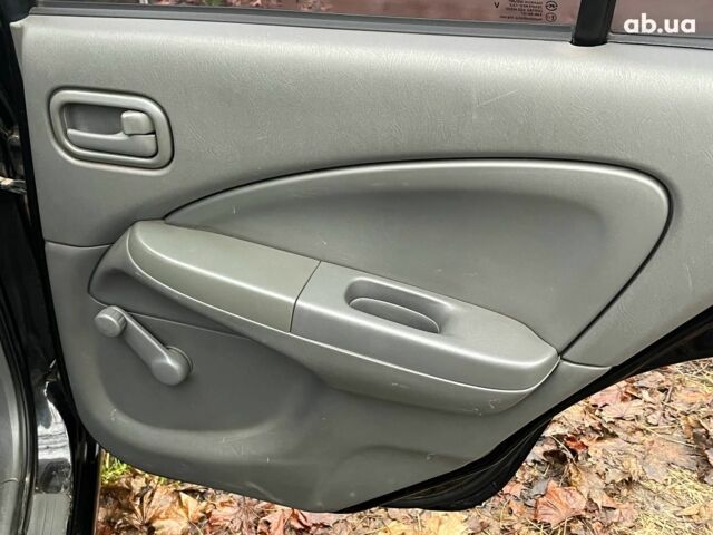 Черный Ниссан Альмера, объемом двигателя 1.6 л и пробегом 203 тыс. км за 5990 $, фото 24 на Automoto.ua