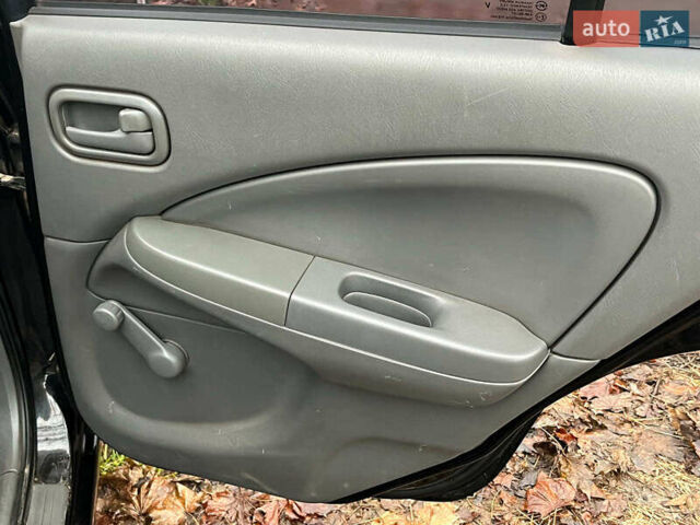 Чорний Ніссан Альмера, об'ємом двигуна 1.6 л та пробігом 203 тис. км за 5990 $, фото 24 на Automoto.ua