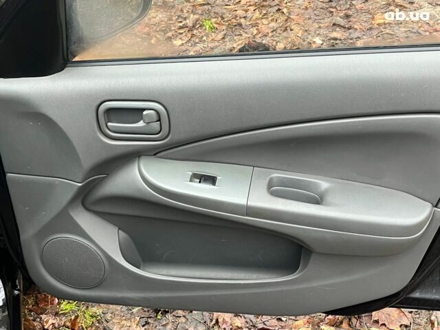 Черный Ниссан Альмера, объемом двигателя 1.6 л и пробегом 203 тыс. км за 5990 $, фото 15 на Automoto.ua