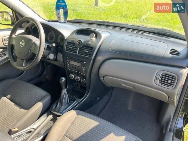 Чорний Ніссан Альмера, об'ємом двигуна 1.6 л та пробігом 202 тис. км за 5800 $, фото 7 на Automoto.ua