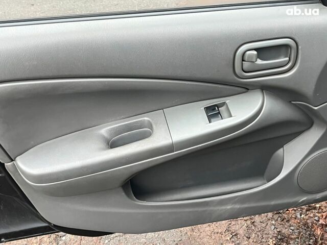 Черный Ниссан Альмера, объемом двигателя 1.6 л и пробегом 203 тыс. км за 5990 $, фото 27 на Automoto.ua