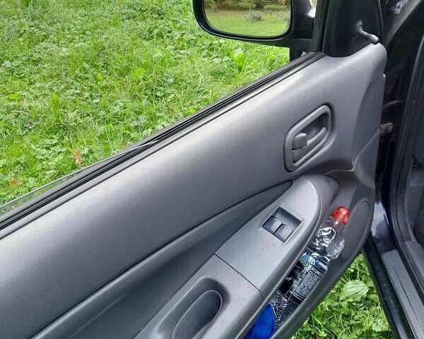 Чорний Ніссан Альмера, об'ємом двигуна 1.6 л та пробігом 241 тис. км за 4150 $, фото 4 на Automoto.ua