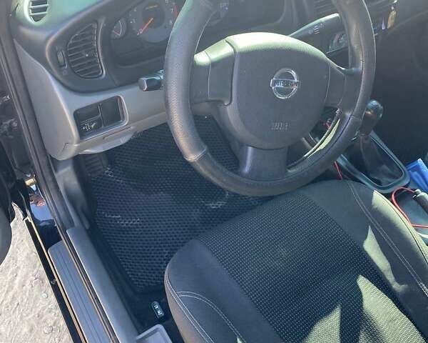 Черный Ниссан Альмера, объемом двигателя 1.6 л и пробегом 143 тыс. км за 6100 $, фото 5 на Automoto.ua