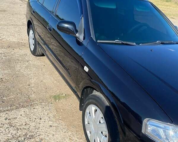 Черный Ниссан Альмера, объемом двигателя 1.6 л и пробегом 143 тыс. км за 6100 $, фото 2 на Automoto.ua