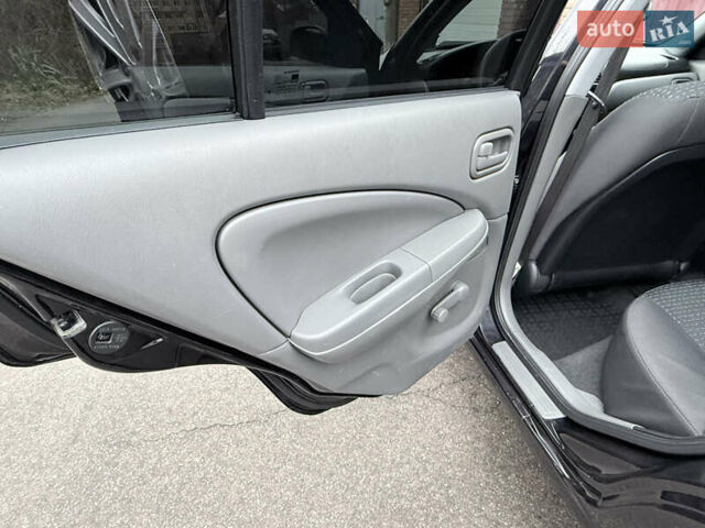 Черный Ниссан Альмера, объемом двигателя 1.6 л и пробегом 123 тыс. км за 6499 $, фото 13 на Automoto.ua