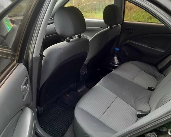 Чорний Ніссан Альмера, об'ємом двигуна 1.6 л та пробігом 241 тис. км за 4150 $, фото 5 на Automoto.ua