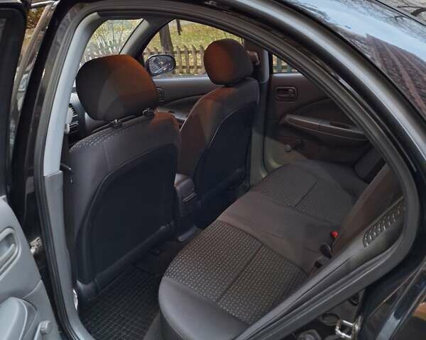 Черный Ниссан Альмера, объемом двигателя 1.6 л и пробегом 173 тыс. км за 6500 $, фото 9 на Automoto.ua