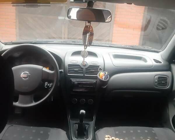 Чорний Ніссан Альмера, об'ємом двигуна 1.6 л та пробігом 63 тис. км за 6700 $, фото 12 на Automoto.ua