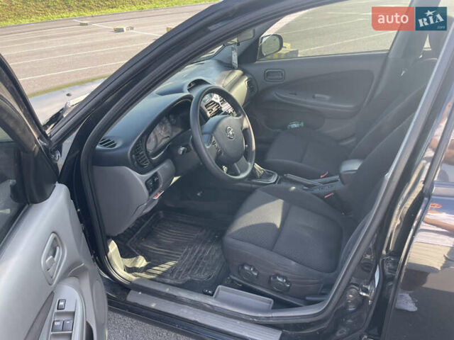 Черный Ниссан Альмера, объемом двигателя 1.6 л и пробегом 242 тыс. км за 5000 $, фото 12 на Automoto.ua