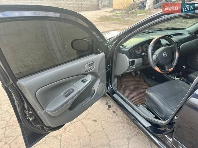 Чорний Ніссан Альмера, об'ємом двигуна 1.6 л та пробігом 140 тис. км за 5900 $, фото 11 на Automoto.ua