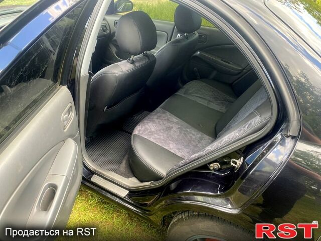 Черный Ниссан Альмера, объемом двигателя 1.6 л и пробегом 157 тыс. км за 5600 $, фото 6 на Automoto.ua