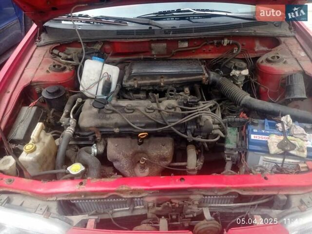 Красный Ниссан Альмера, объемом двигателя 1.39 л и пробегом 332 тыс. км за 1300 $, фото 6 на Automoto.ua