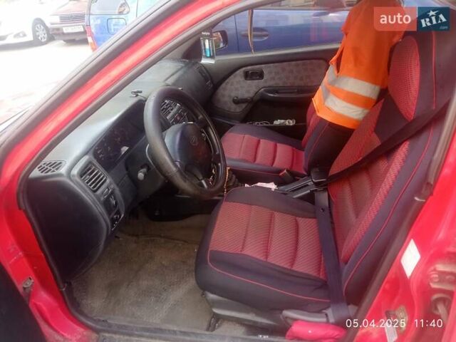 Красный Ниссан Альмера, объемом двигателя 1.39 л и пробегом 332 тыс. км за 1300 $, фото 5 на Automoto.ua