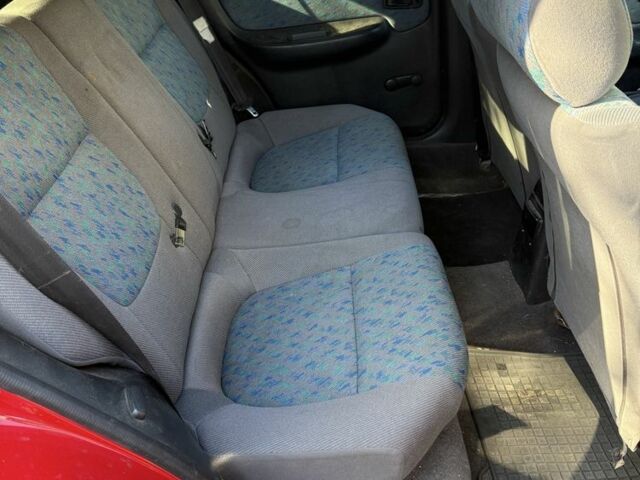 Червоний Ніссан Альмера, об'ємом двигуна 1.4 л та пробігом 293 тис. км за 1200 $, фото 7 на Automoto.ua