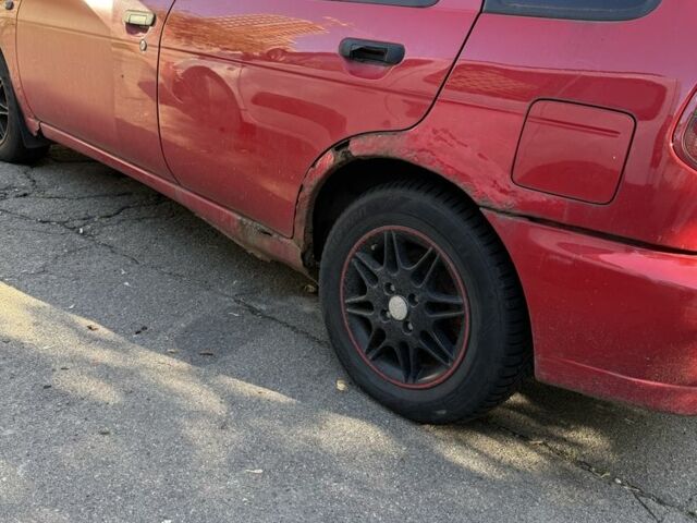 Червоний Ніссан Альмера, об'ємом двигуна 1.4 л та пробігом 293 тис. км за 1200 $, фото 4 на Automoto.ua