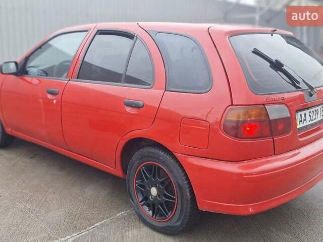 Красный Ниссан Альмера, объемом двигателя 1.39 л и пробегом 29 тыс. км за 2250 $, фото 4 на Automoto.ua