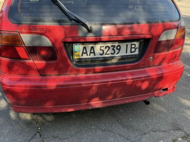 Червоний Ніссан Альмера, об'ємом двигуна 1.4 л та пробігом 293 тис. км за 1200 $, фото 5 на Automoto.ua