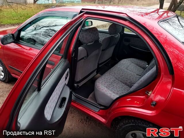 Красный Ниссан Альмера, объемом двигателя 1.4 л и пробегом 174 тыс. км за 2300 $, фото 8 на Automoto.ua