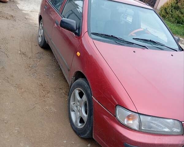 Красный Ниссан Альмера, объемом двигателя 1.4 л и пробегом 300 тыс. км за 1100 $, фото 16 на Automoto.ua