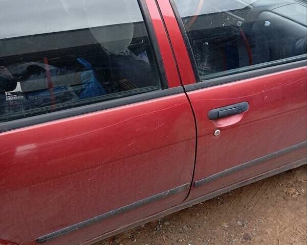 Красный Ниссан Альмера, объемом двигателя 1.4 л и пробегом 300 тыс. км за 1100 $, фото 3 на Automoto.ua