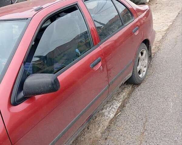 Красный Ниссан Альмера, объемом двигателя 1.4 л и пробегом 300 тыс. км за 1100 $, фото 12 на Automoto.ua