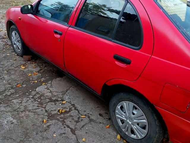 Червоний Ніссан Альмера, об'ємом двигуна 1.4 л та пробігом 0 тис. км за 1200 $, фото 1 на Automoto.ua