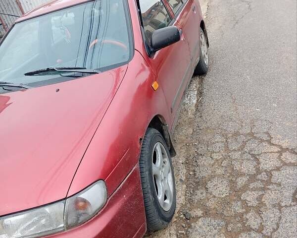 Красный Ниссан Альмера, объемом двигателя 1.4 л и пробегом 300 тыс. км за 1100 $, фото 14 на Automoto.ua