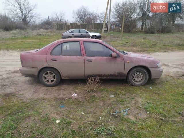 Красный Ниссан Альмера, объемом двигателя 2 л и пробегом 200 тыс. км за 1300 $, фото 3 на Automoto.ua