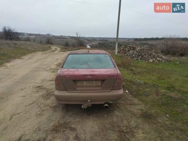 Красный Ниссан Альмера, объемом двигателя 2 л и пробегом 200 тыс. км за 1300 $, фото 2 на Automoto.ua