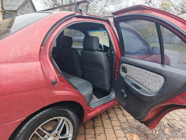 Червоний Ніссан Альмера, об'ємом двигуна 1.4 л та пробігом 3 тис. км за 1900 $, фото 4 на Automoto.ua